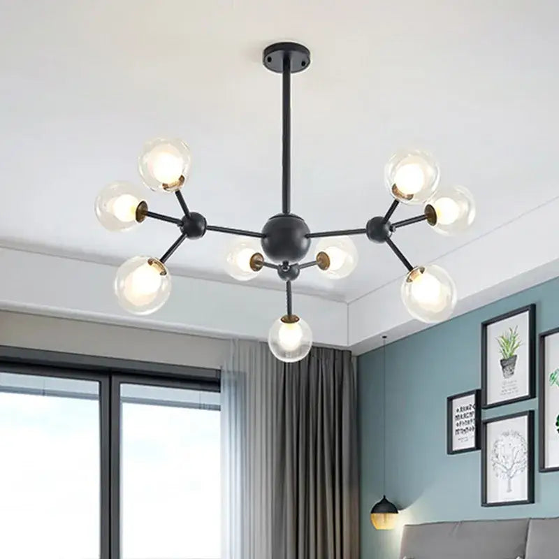 Black postmodern sputnik chandelier with clear glass globes and brass accents for dining room decorbites black postmodern