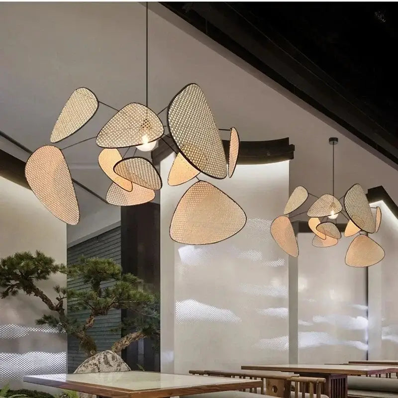 Modern decorbites black rattan ceiling chandelier with woven leaf-shaped beige shades for dining room decor