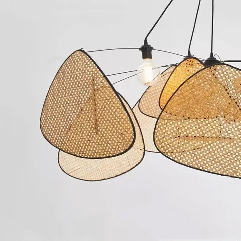 A modern decorbites black rattan ceiling chandelier with triangular woven rattan shades in beige and warm amber tones
