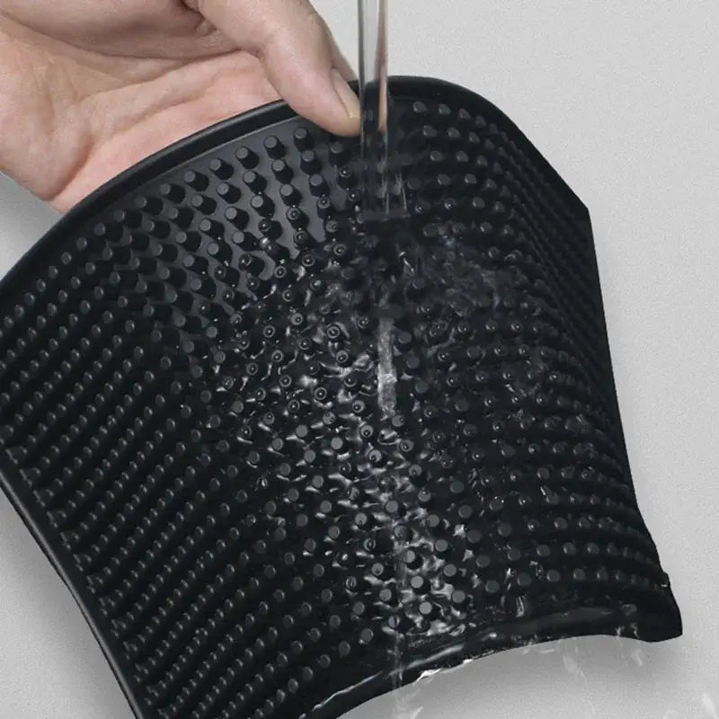 Black silicone bath brush with raised dot pattern for scrubbing paired with rubber raised dot coffee bar cup mats decorbites coffee bar