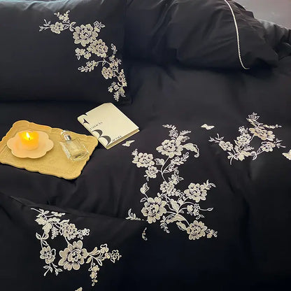 Black satin bedding set with intricate white egyptian cotton flowers embroidery for elegant bedroom decor