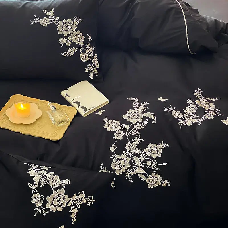 Black satin bedding set with intricate white egyptian cotton flowers embroidery for elegant bedroom decor