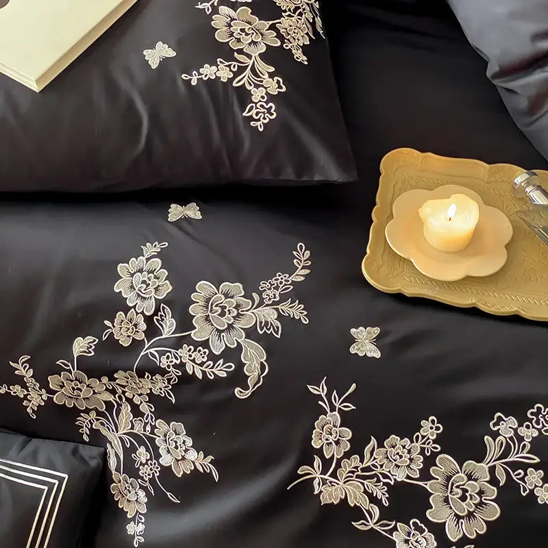 Black satin bedding set with intricate gold and white egyptian cotton flowers embroidery for bedroom use