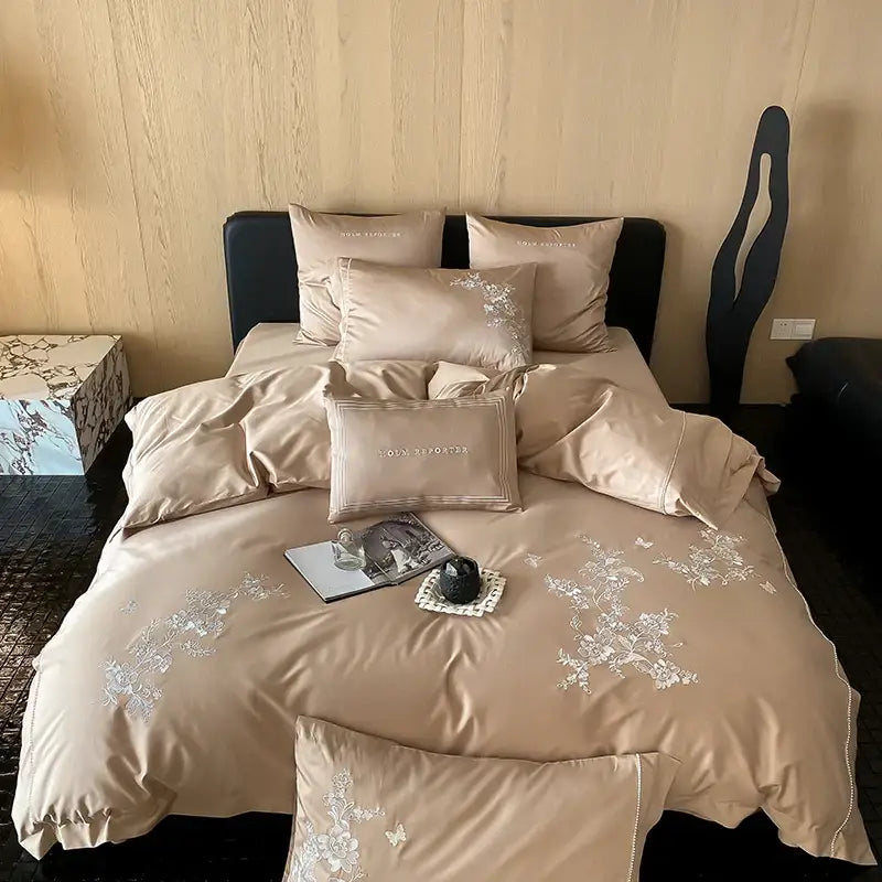 Beige satin bedding set with delicate cotton flowers embroidery and matching pillows in black satin cotton flowers design