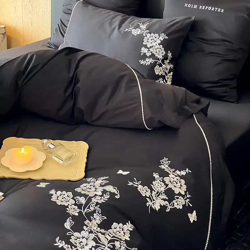 Black satin duvet cover with delicate white egyptian cotton flowers embroidery and pearl-like trim bedding set