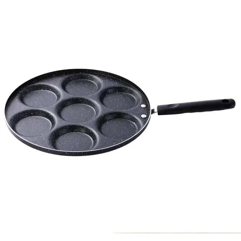 Black speckled non-stick decorbites breakfast egg pan with seven circular holes and black handle for pancakes and eggs