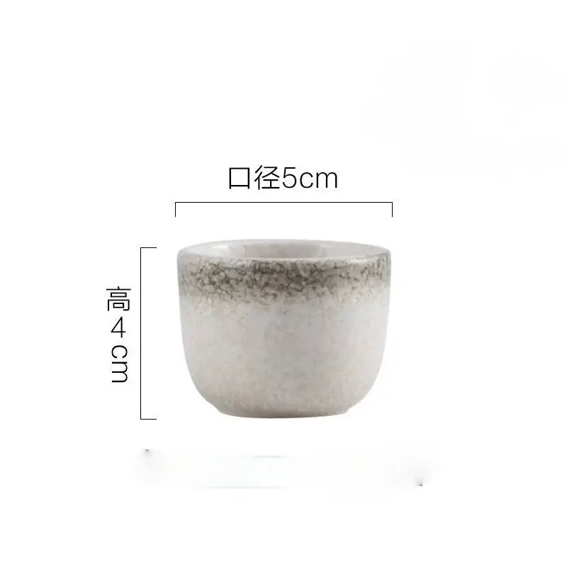 A small handcrafted ceramic wine sake cup with speckled gray white glaze from decorbites wine sake set