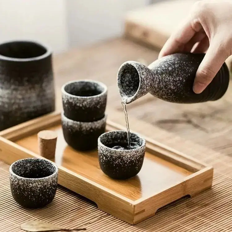Black speckled ceramic wine sake set with matching pitcher and cups on wooden tray for dining room decorbites ceramic wine