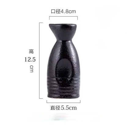 Black speckled ceramic wine sake bottle with textured surface and subtle horizontal ridges for decorbites ceramic wine set