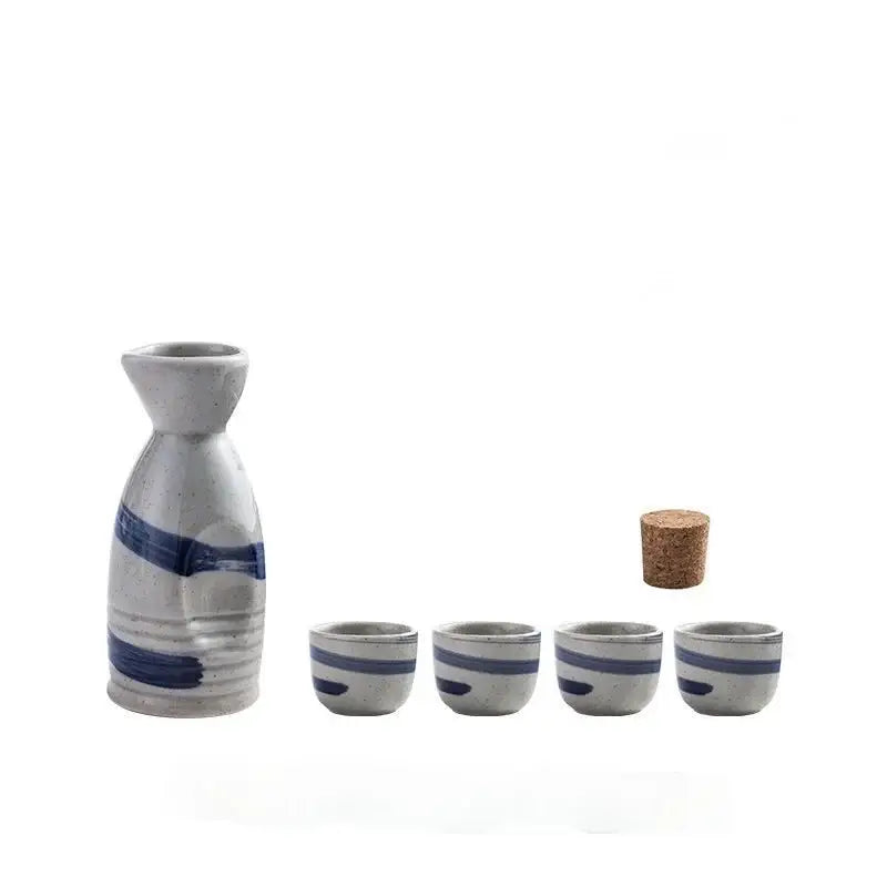 Black speckled ceramic wine sake set with heater featuring tall white bottle with blue stripes and four matching cups