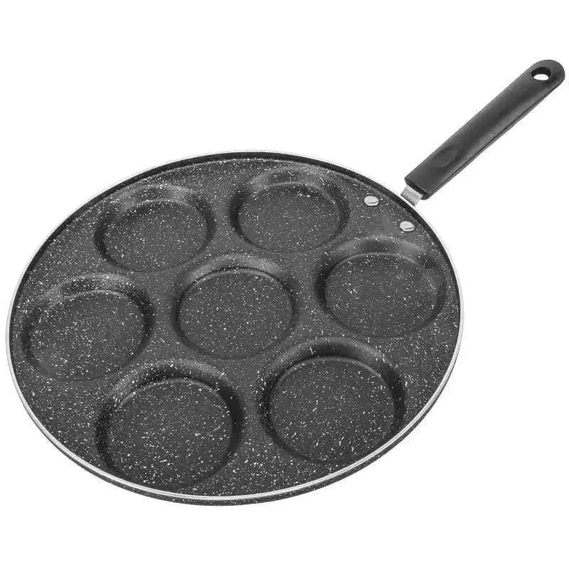 Black speckled non-stick breakfast egg pan with six circular sections and black handle by decorbites breakfast egg