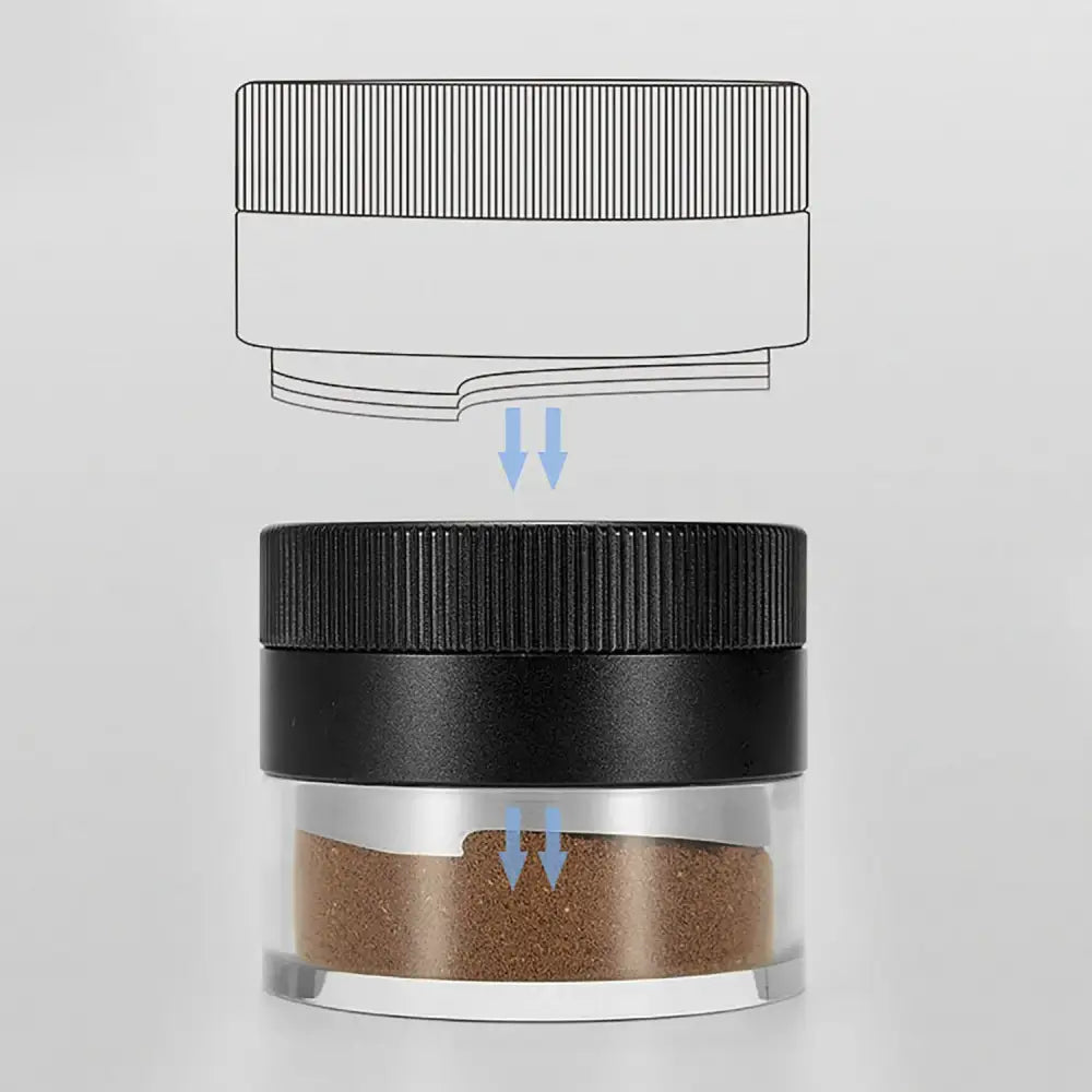Black textured decorbites espresso tamper with ribbed screw-top lid on clear glass jar containing brown granules
