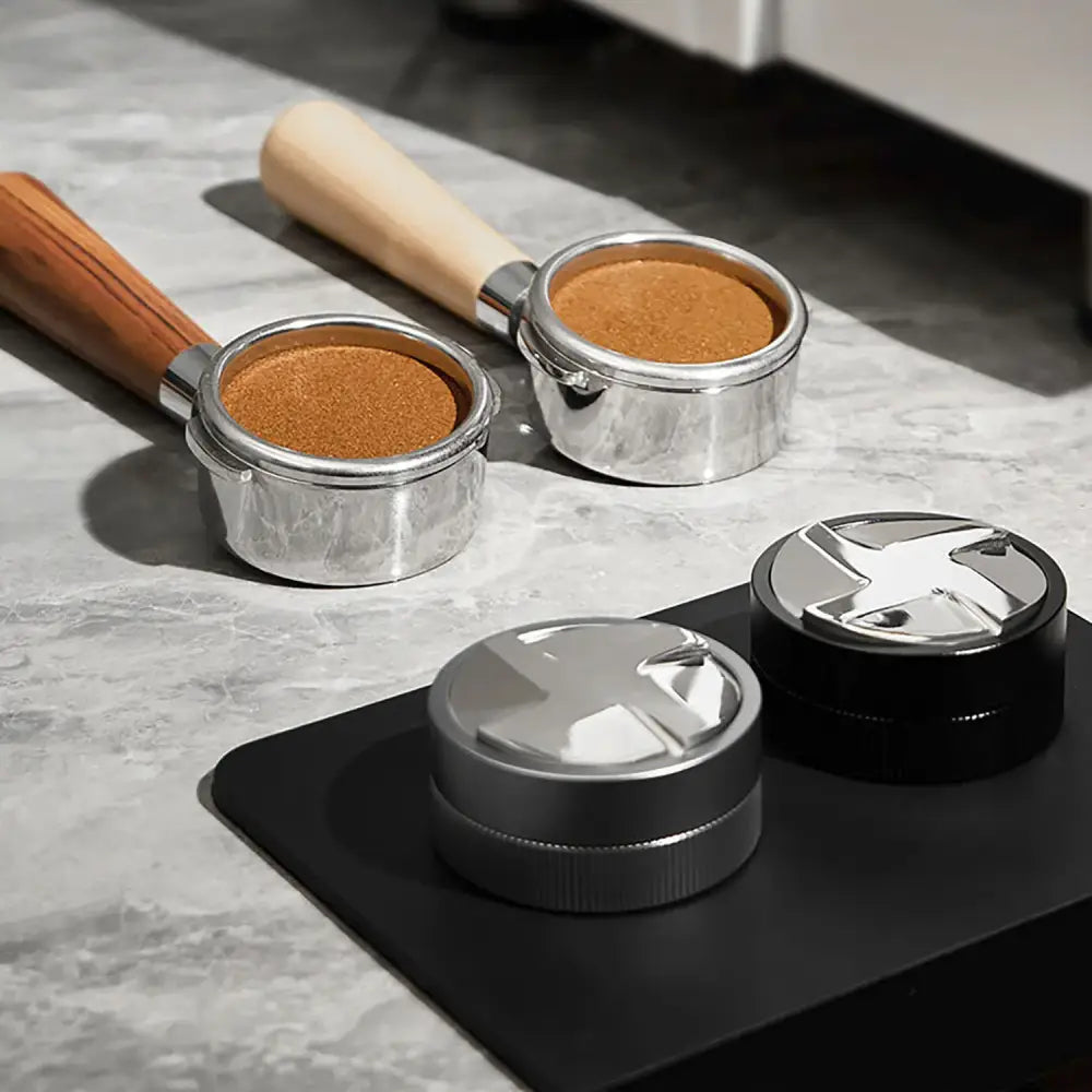 Silver and black decorbites espresso tamper with textured grip and modern design for precise kitchen use