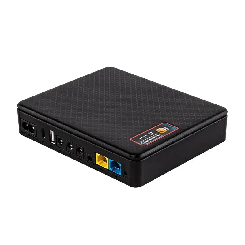 Black textured mini ups backup battery office router power supply with carbon fiber finish and multiple ports shown from back
