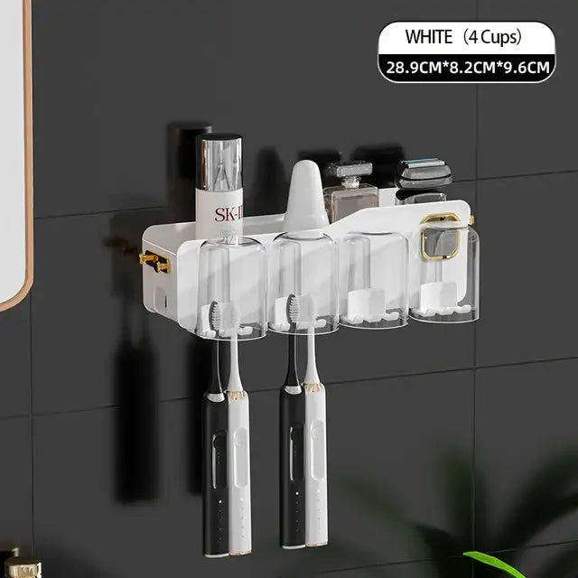 White toothbrush holder with four transparent cups and gold-tone accents for decorbites inverted toothbrush storage rack