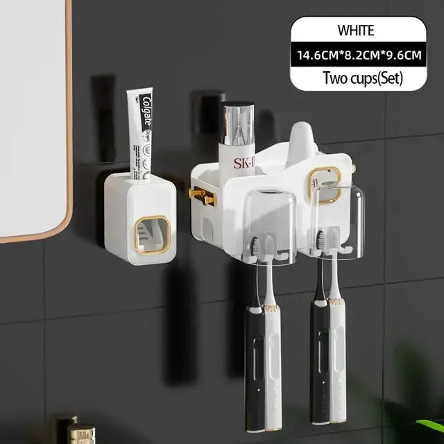 White and gold decorbites inverted toothbrush holder with two transparent cups mounted on bathroom wall for electric toothbrushes