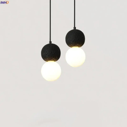 Black travertine led pendant light with black lava stone and frosted glass globe for dining room decorbites black travertine