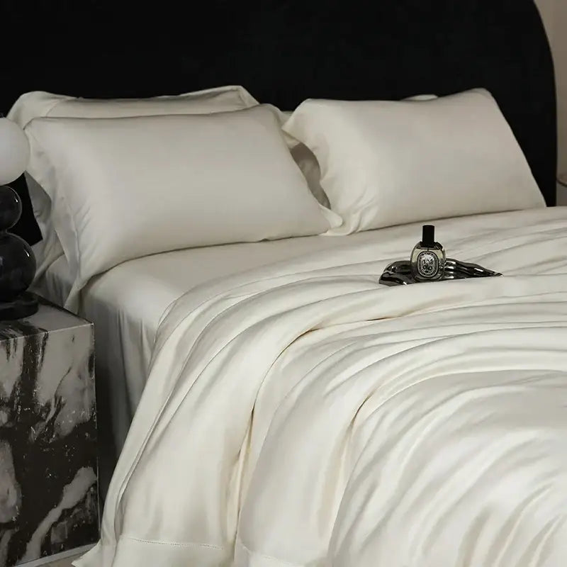 Cream-colored satin bedding set with smooth glossy finish made of lyocell eucalyptus fiber for luxury bedroom use
