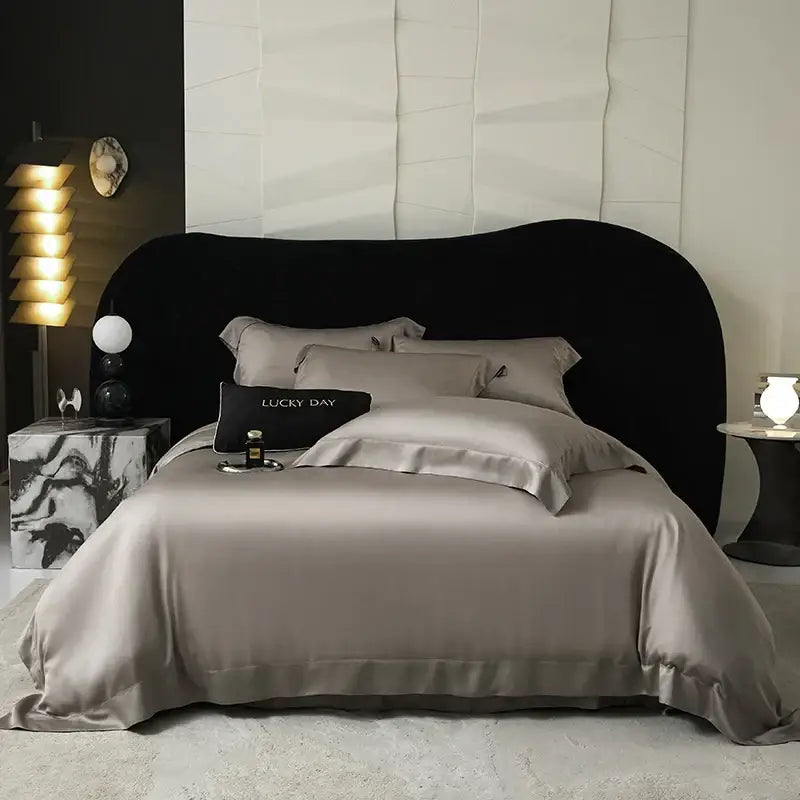 Silk satin gray bedding set with lyocell eucalyptus fiber and a matching pillow sham featuring lucky day in gold lettering