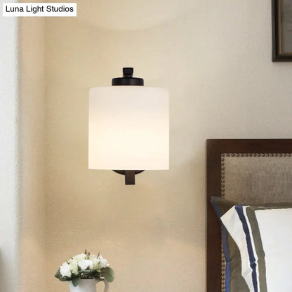 Black Wall Sconce with Ivory Glass Cylinder and Curved Arm - 1-Light, Wall Mounted Lamp