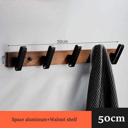 A sleek 50cm wall-mounted coat rack with walnut shelf and black aluminum hooks in decorbites black walnut bathroom set