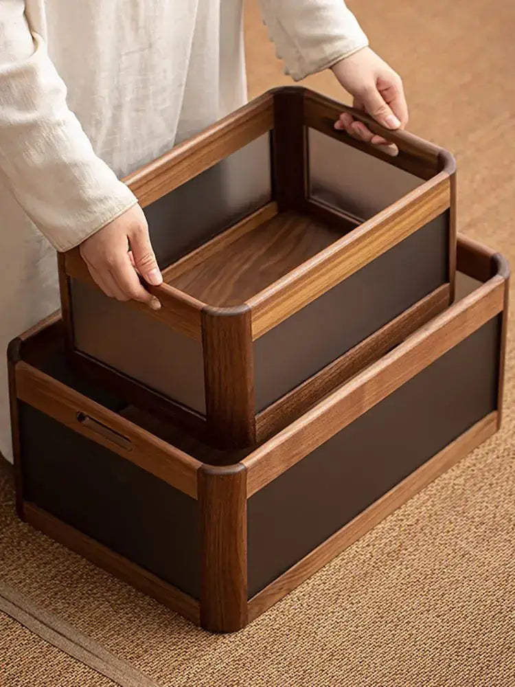 Set of two nested desktop organizer boxes with black walnut wood frames and matte black panels for office storage