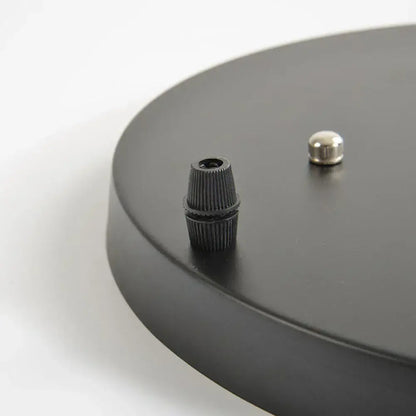 Black matte pendant light base canopy plate with textured threaded connector and silver cap for dining room chandelier