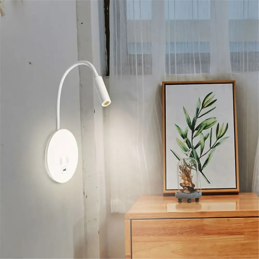 White curved corded gooseneck wall sconce with circular base and usb ports by decorbites for bedroom lighting