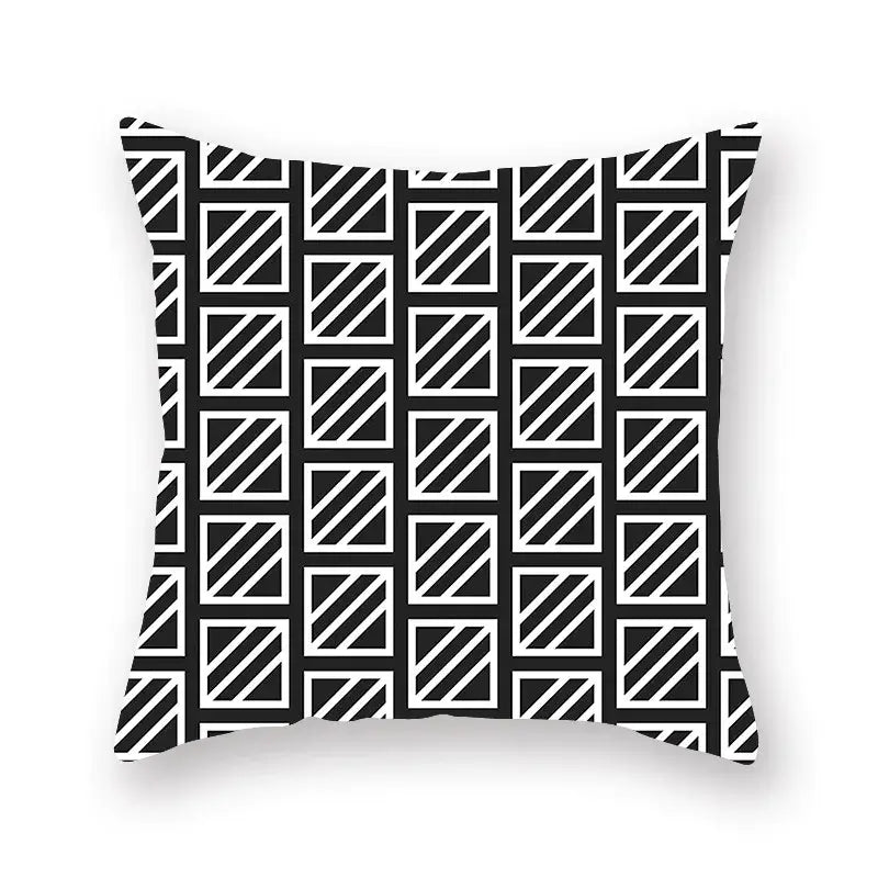 Black and white geometric star stripe throw pillow with diagonal stripes inside outlined squares for bedroom decor