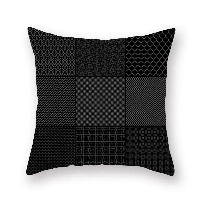 Black throw pillow with geometric star stripe patchwork design in gray shades for bedroom decor use
