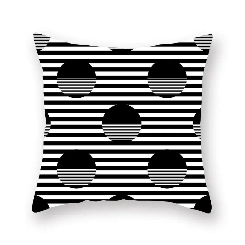 Black and white geometric star stripe throw pillow with bold stripes and solid circles for bedroom decor