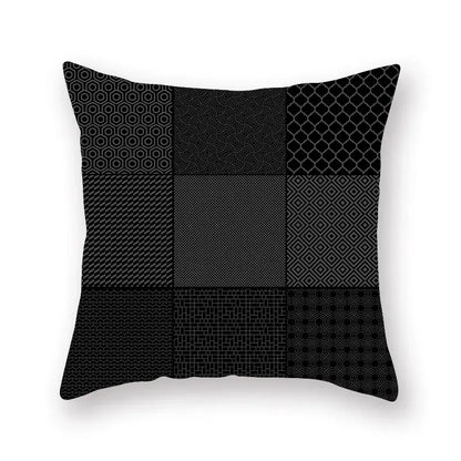 Black throw pillow with geometric star stripe patchwork design in gray shades for bedroom decor