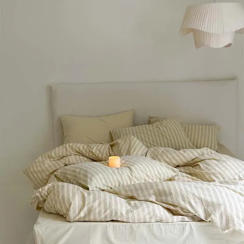 A cozy beige and cream striped cotton duvet cover set with soft textured fabric for bedroom bedding use