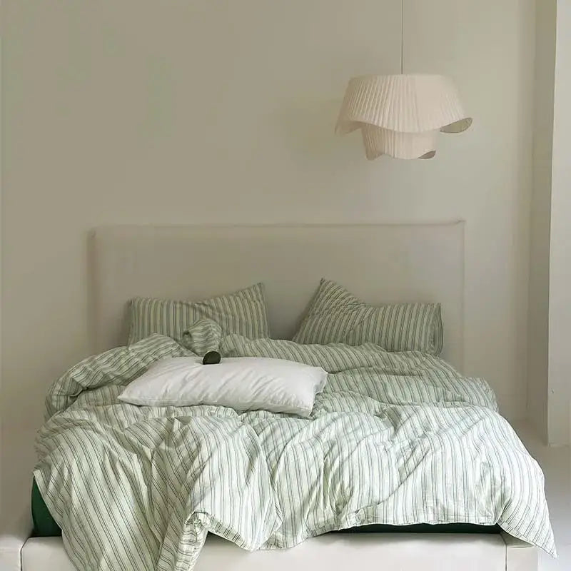 Black and white striped cotton duvet cover set with a soft mint green and white textured cover set for bedroom bedding