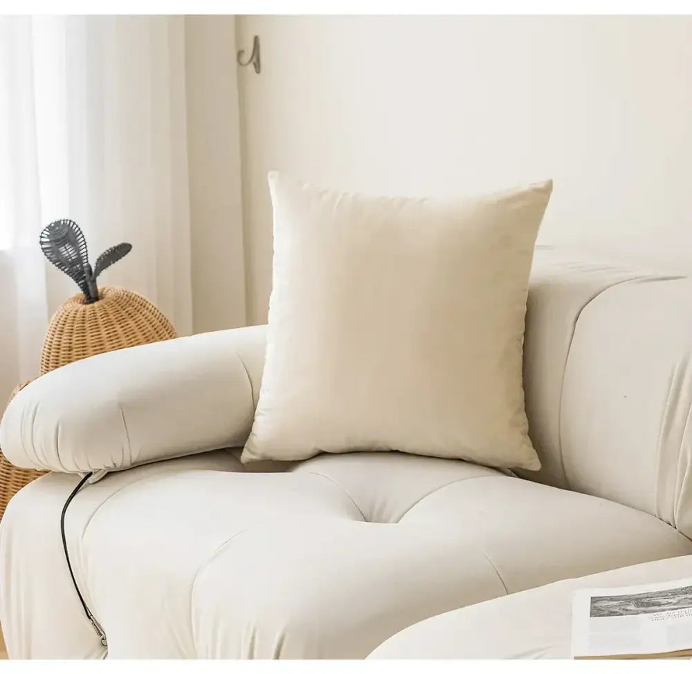 Cream-colored square cushion with soft plush fabric on sofa complementing decorbites knitted crochet cushion cover