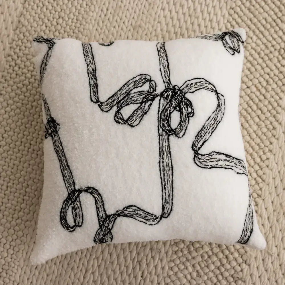 White felt cushion cover with intricate black embroidered ribbon patterns decorbites knitted crochet for living room decor