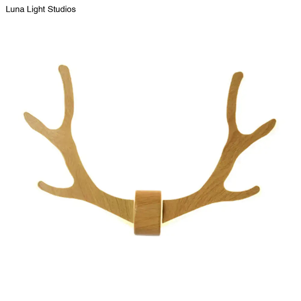 Lightweight black wooden antler wall sconce lamp with natural finish and warm LED lighting for corridor use