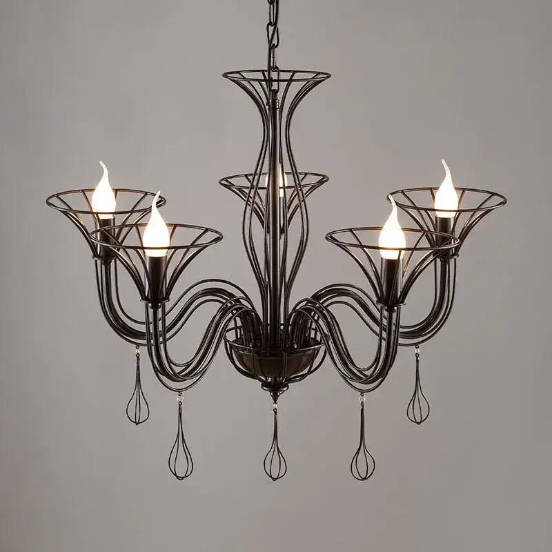 Black wrought iron chandelier with five candle-style bulbs and dangling whisker-like teardrop pendants for dining room decor