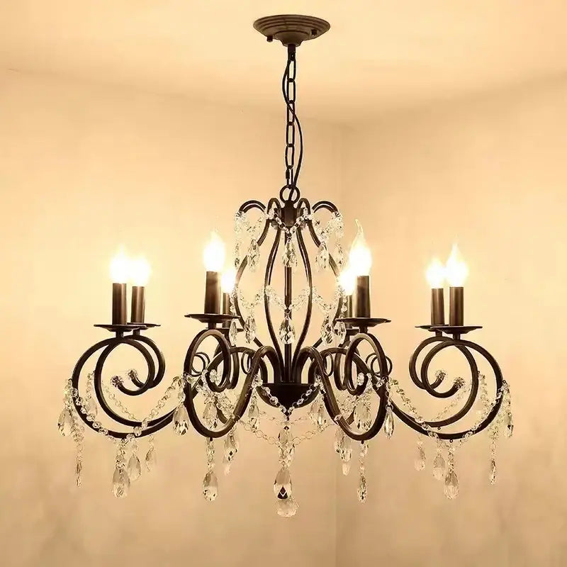 Antique bronze decorbites crystal candle chandelier with intricate scrollwork and dangling crystals for living room lighting