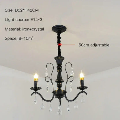 Black wrought iron crystal chandelier with candle-style bulbs and crystal droplets for dining room lighting