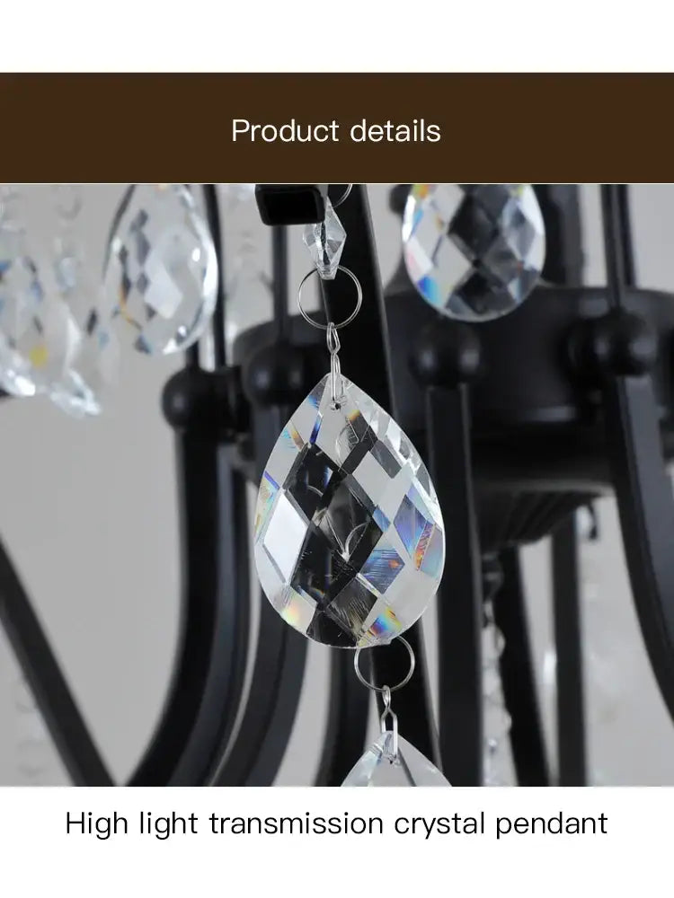 Clear faceted teardrop crystal pendant with high light transmission on black wrought iron chandelier for dining room