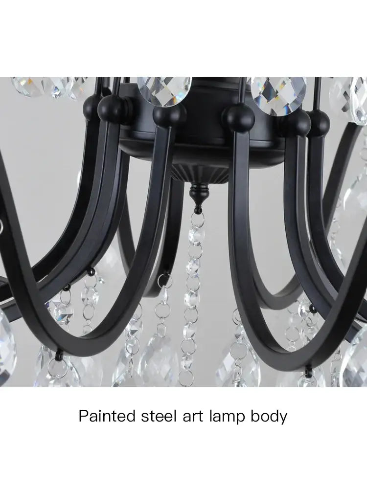Black wrought iron chandelier with crystal droplets and faceted accents for dining room lighting