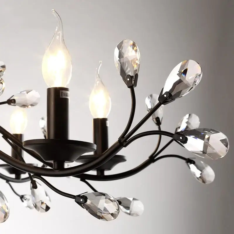 Black wrought iron crystal led chandelier with clear teardrop accents and candle bulbs for dining room decorbites crystal led