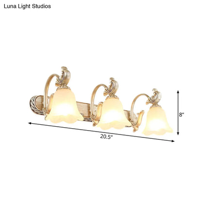 Lámpara de pared Blossom Vanity Lighting - Aplique de pared de latón y cristal color crema con brazo curvo