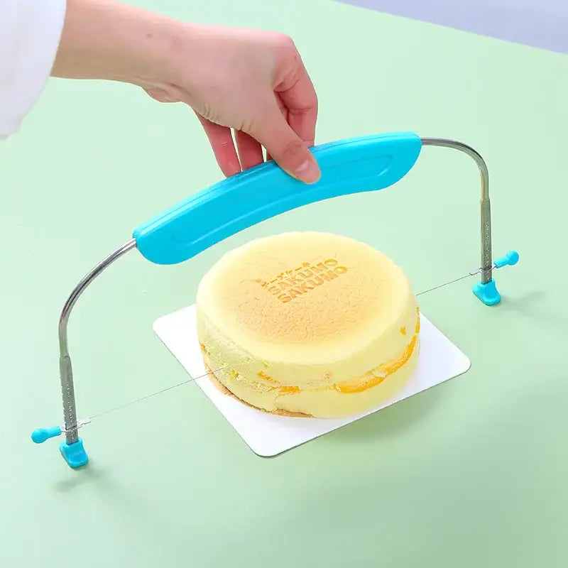 Blue adjustable stainless steel cake slicer with blue handles and clamps baking tool by decorbites