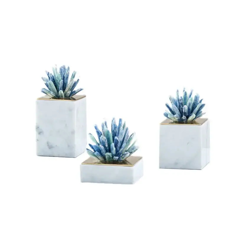 Set of three white marble square planters with gold-trimmed tops holding blue green agate stone crystal succulents for decorbites agate stone sculpture living room ornament