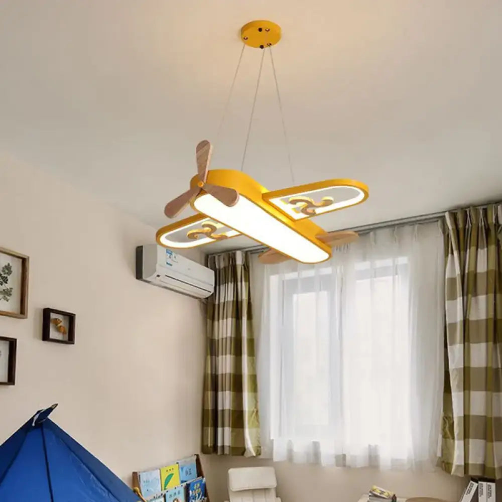 Yellow airplane-shaped pendant light with wooden propeller and wings featuring remote control stepless dimming perfect addition