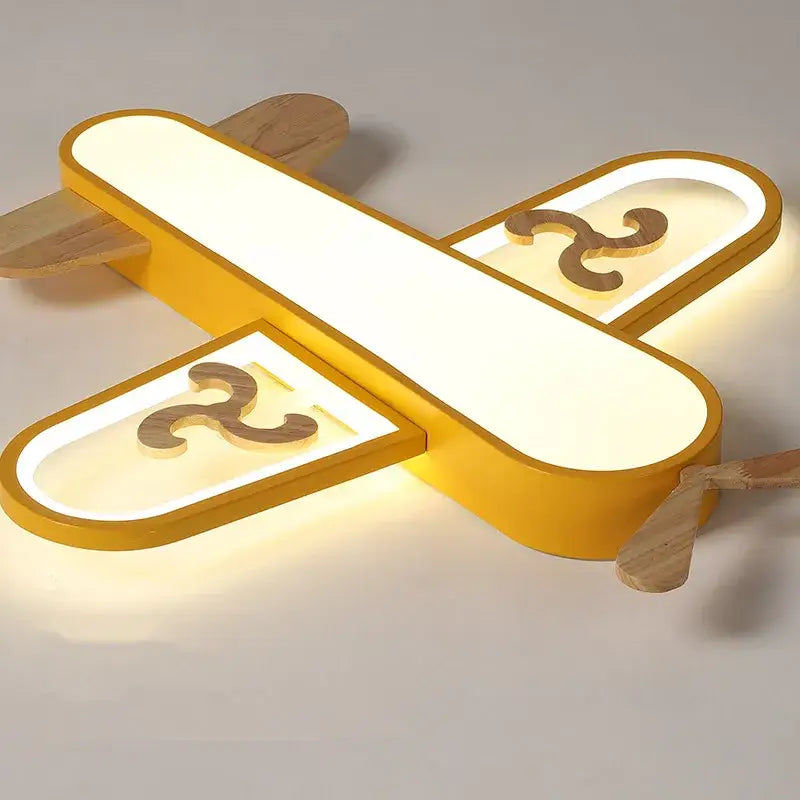 Yellow airplane-shaped decorbites led wood ceiling light with wooden accents and illuminated wings for kids bedroom