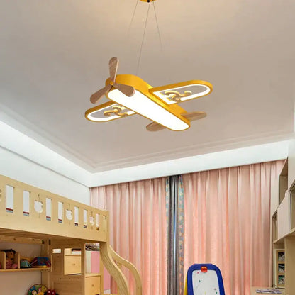 Yellow airplane-shaped led wood ceiling light with wooden propeller and wings by decorbites for kids bedroom decor