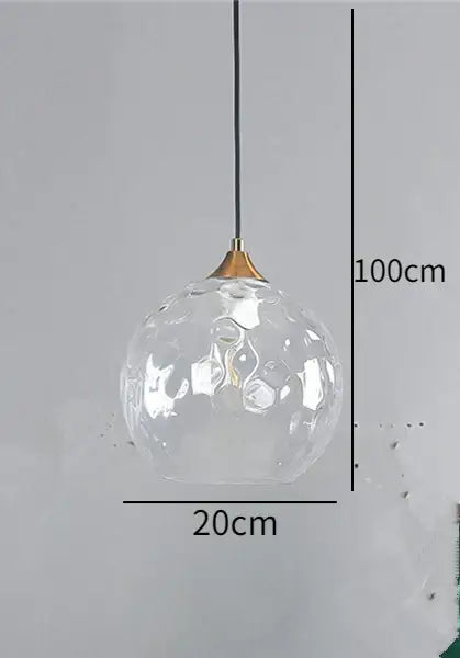 Blue and amber decorbites glass ball pendant with textured bubble surface and brass ball pendant led fixture for kitchen decor